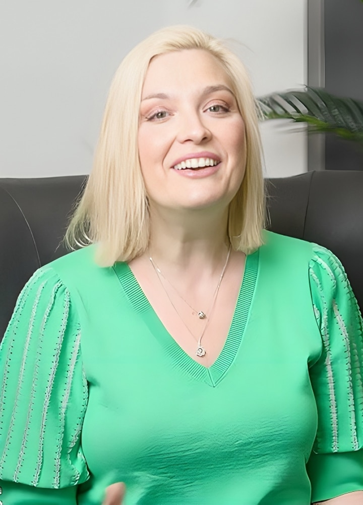 A woman is smiling